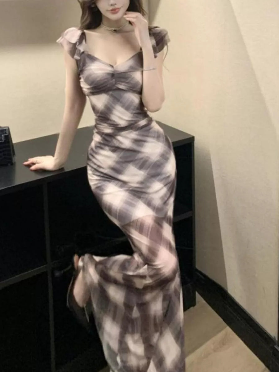 Ruched plaid bodycon maxi dress in brown with sweetheart neckline and sheer flutter sleeves.