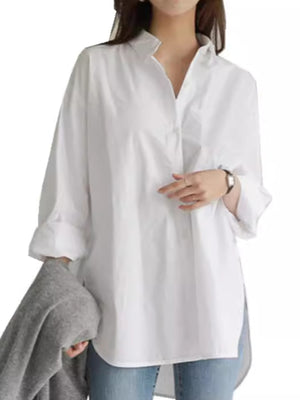 button-down shirt in white featuring high-low hem and oversized fit