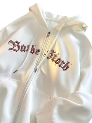 White zip up hoodie with drawstring and gothic text graphic