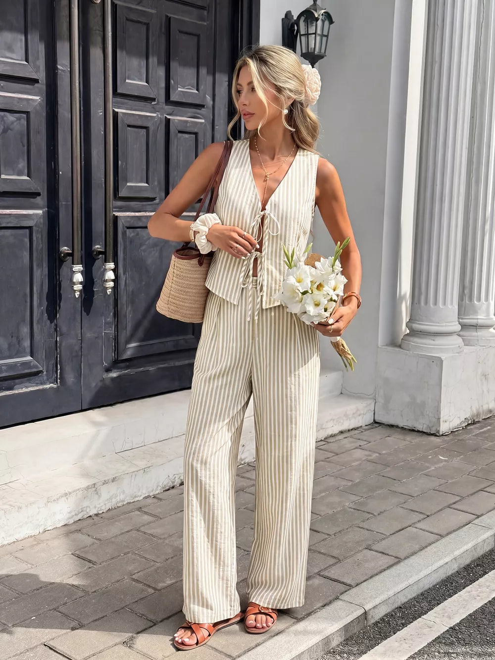 Chic striped two-piece vest and pants set with tie front vest and wide leg pants.