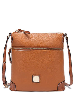 Golden Hour Leather Crossbody bag in Coffee Brown with two zip pockets and gold-tone hardware.