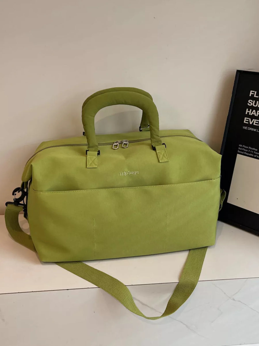 Lime green duffel bag with top handles and adjustable shoulder strap.