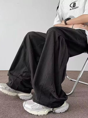 Black relaxed fit casual cargo pants with a comfortable fit and button detail.