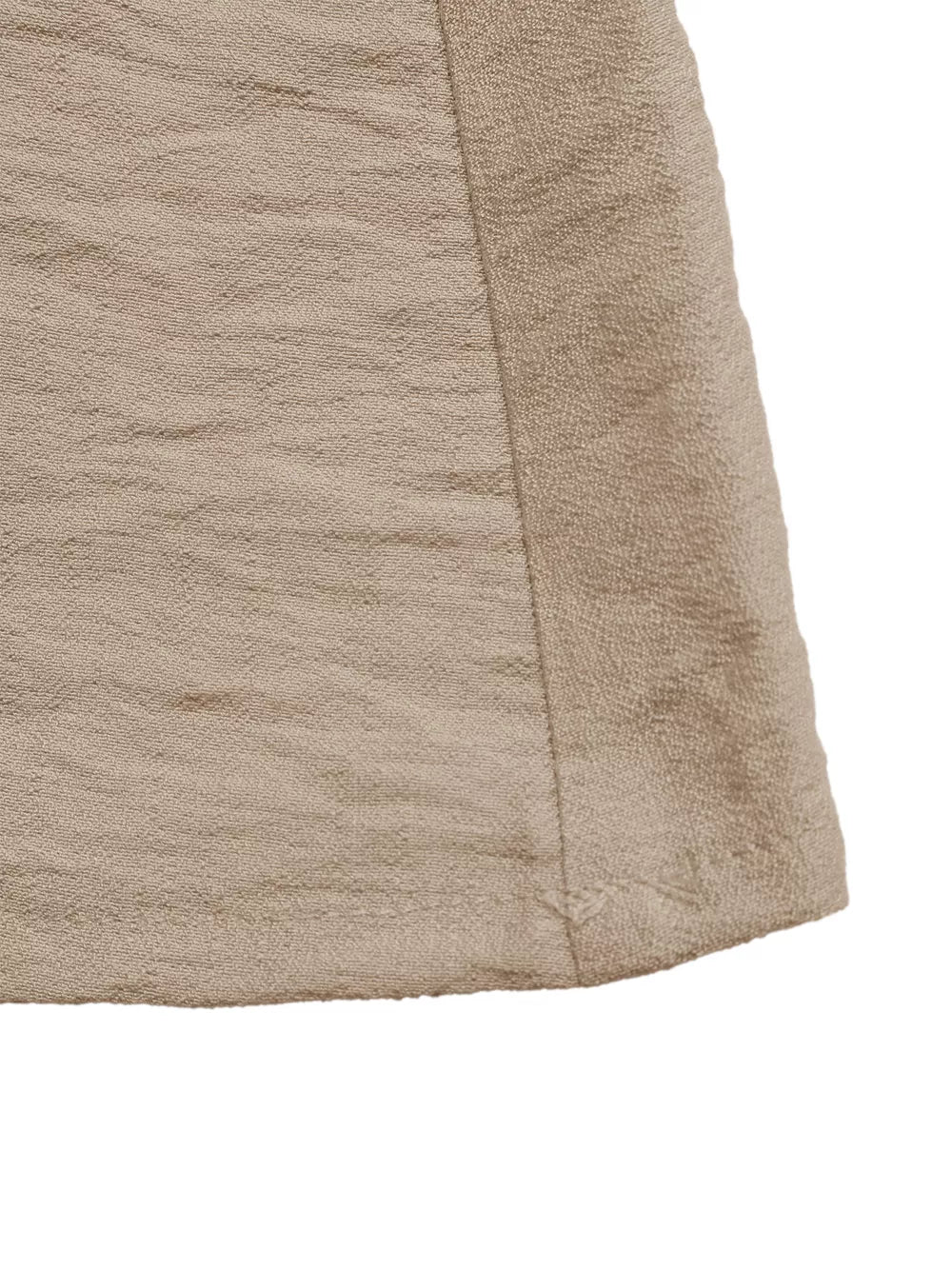 Textured beige maxi dress with elegant silhouette and subtle sheen.