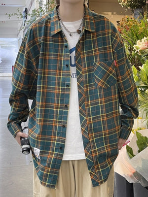 Green plaid long sleeve collared shirt with chest pocket