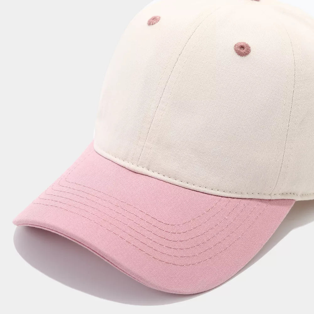 blush pink cap featuring curved brim and color-block