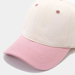 blush pink cap featuring curved brim and color-block