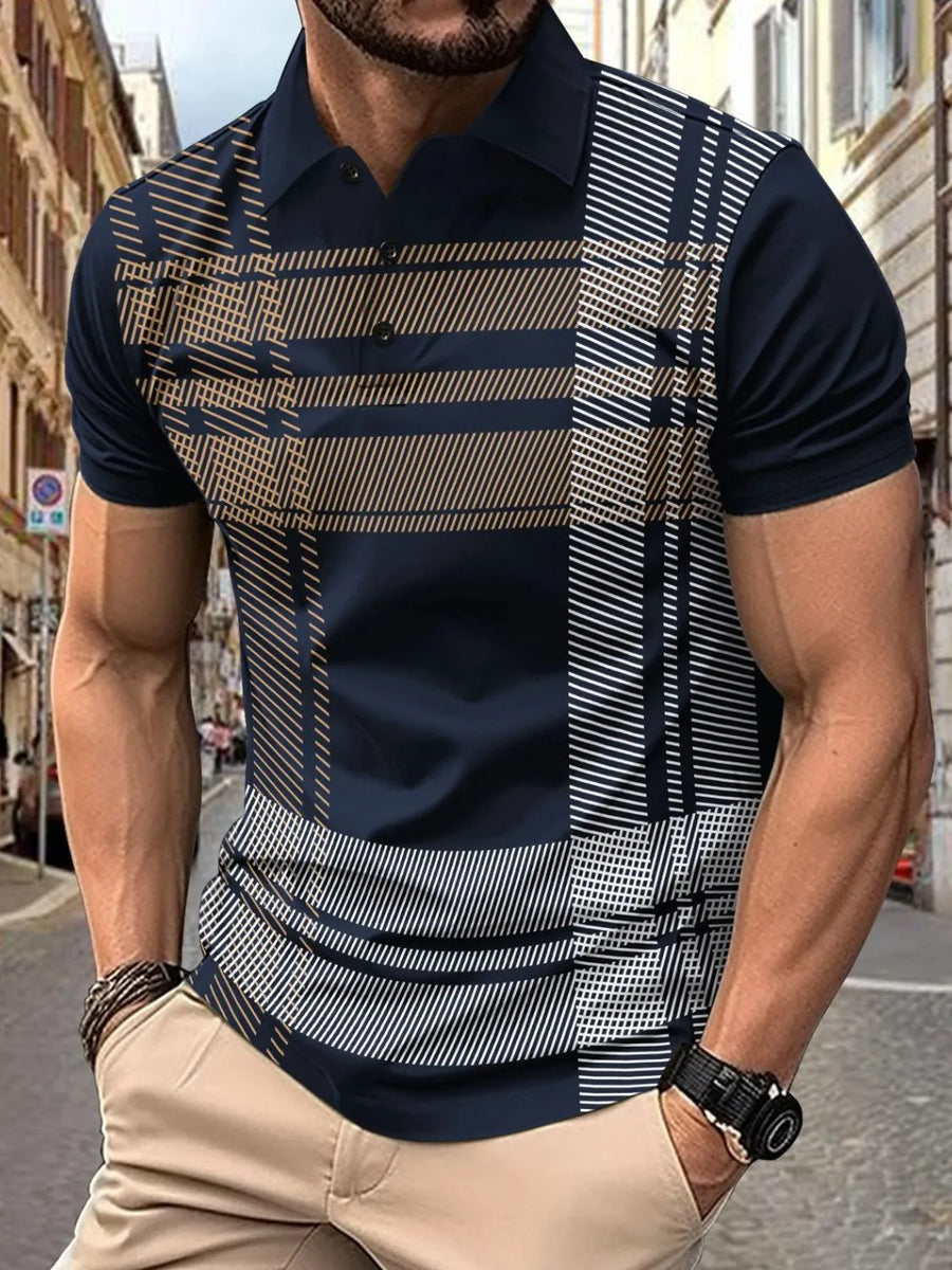 Navy geometric polo shirt with graphic panel and short sleeves.