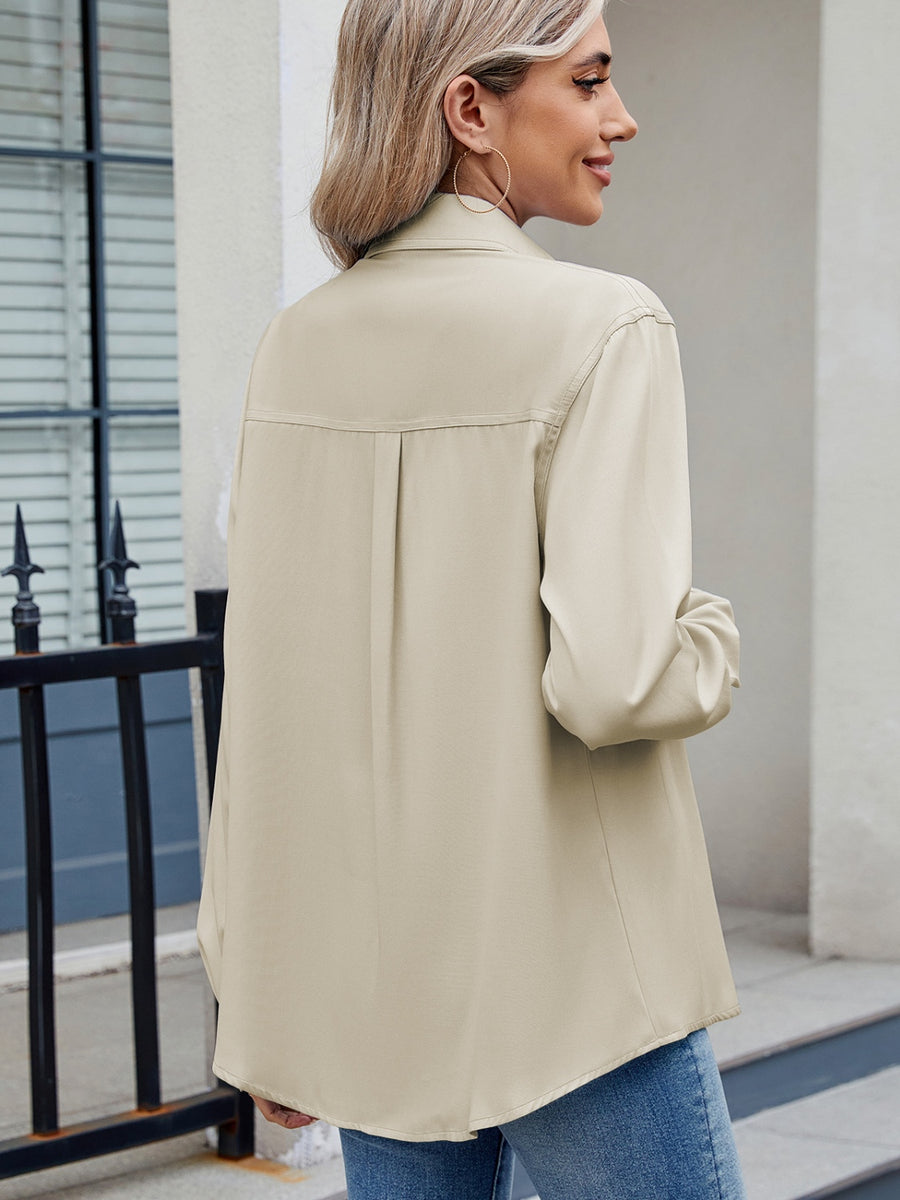 Beige utility crepe shirt with tie detail, long sleeves, and back pleat.