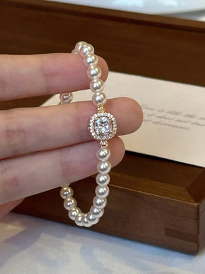 Synthetic Pearl, 18K Gold-Plated, Alloy, Zircon Care instructions: Avoid wearing bracelet in White with n/a silhouette
