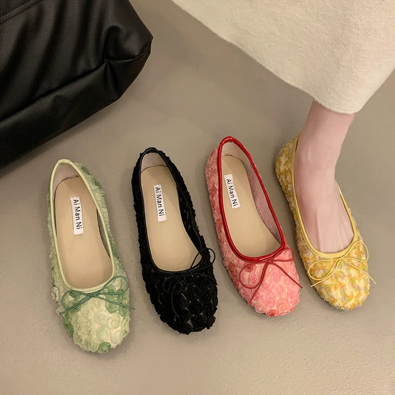 Charming floral bow slip-on flats in black, pink, green, and yellow with 3D texture.