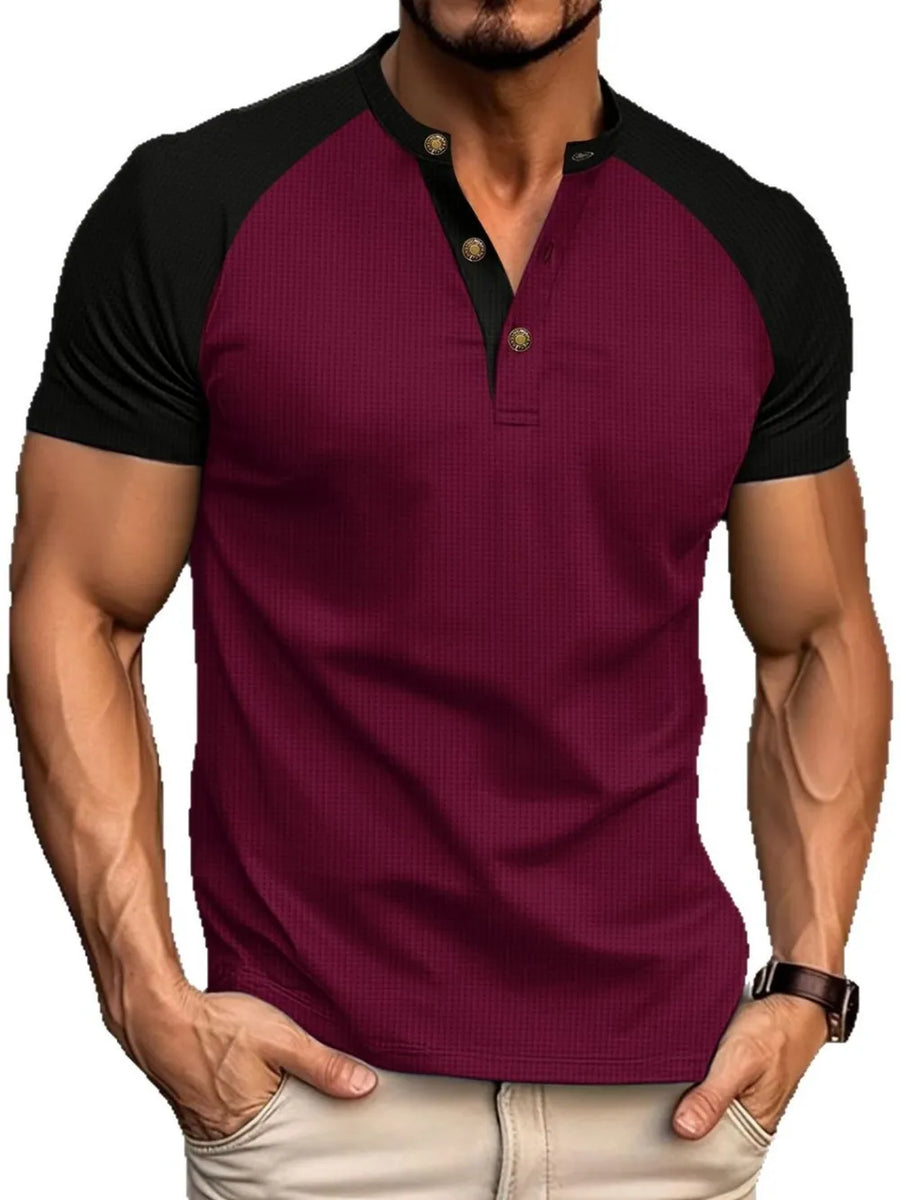 Burgundy raglan henley polo shirt with black sleeves and gold buttons