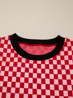 Red and white checkered print shirt with a black crew neck.