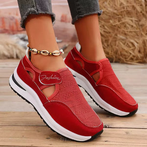 Red breathable slip-on sneakers with cutout details and a "Fashion" accent.