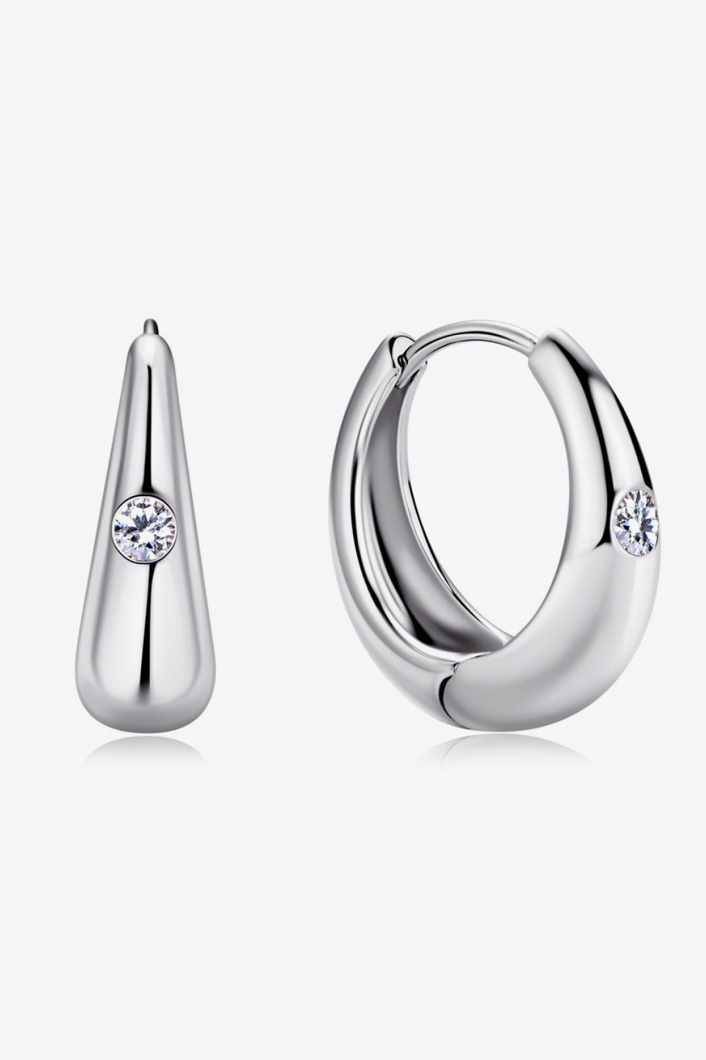 Silver hoop earrings and teardrop earrings with crystal accents, made of 925 sterling silver.
