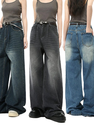Oversized denim palazzo jeans in black and blue washes with subtle fading.