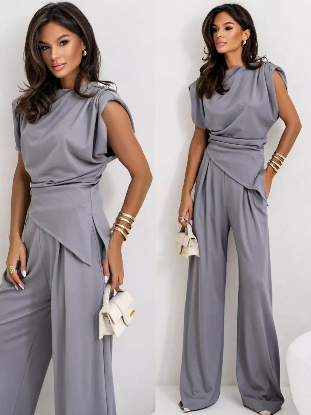 Gray satin cowl neck two-piece set with wide-leg pants and draped top.
