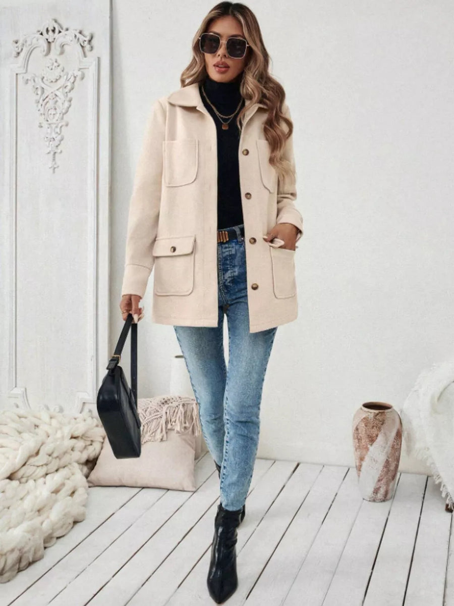 Chic apricot button-front trench coat with four pockets and a relaxed fit.