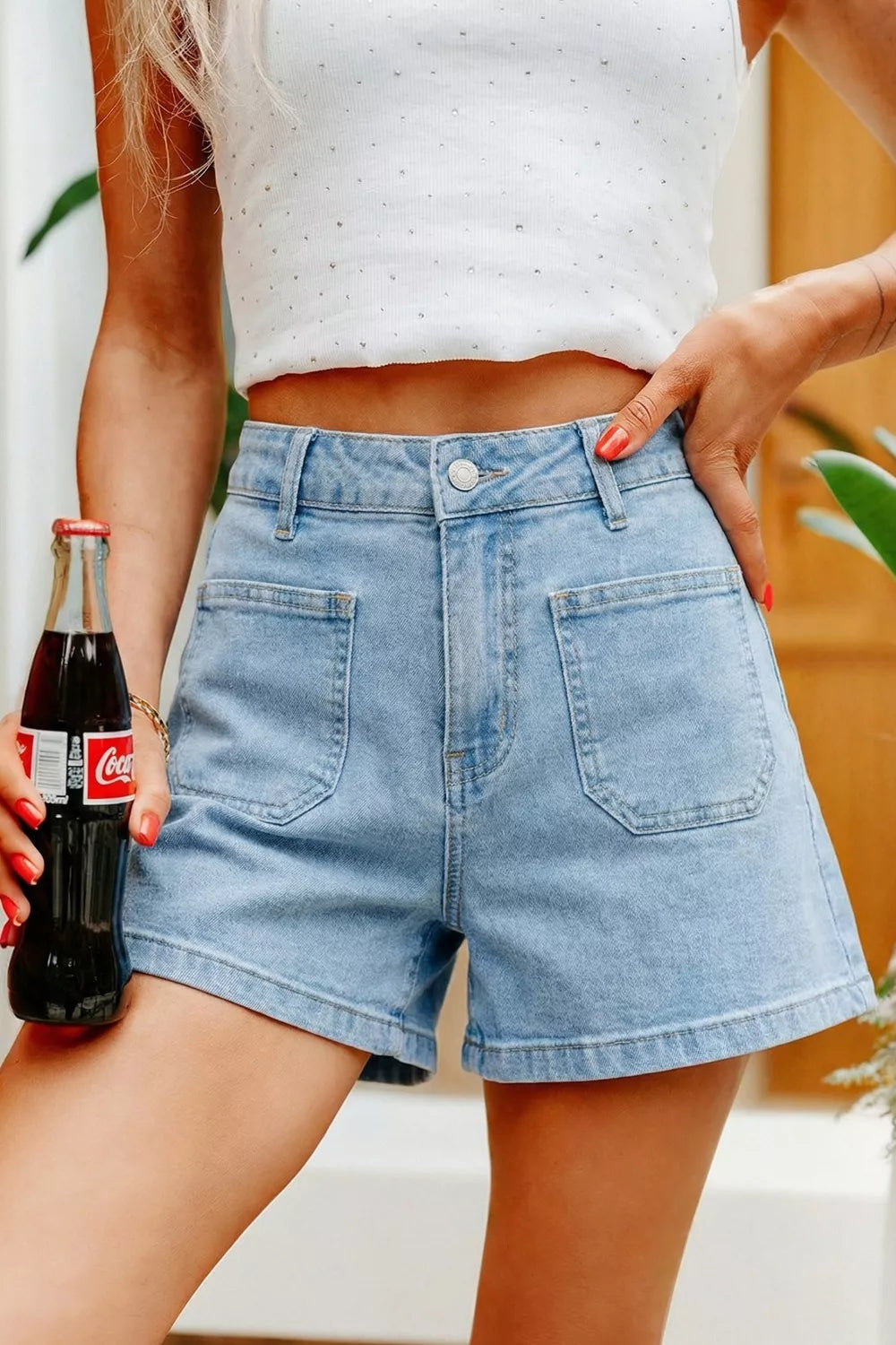 Light wash denim shorts with high rise and patch pockets