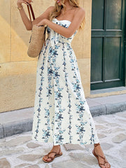 Floral smocked tie-front wide-leg romper in white with blue floral print, strapless neckline.