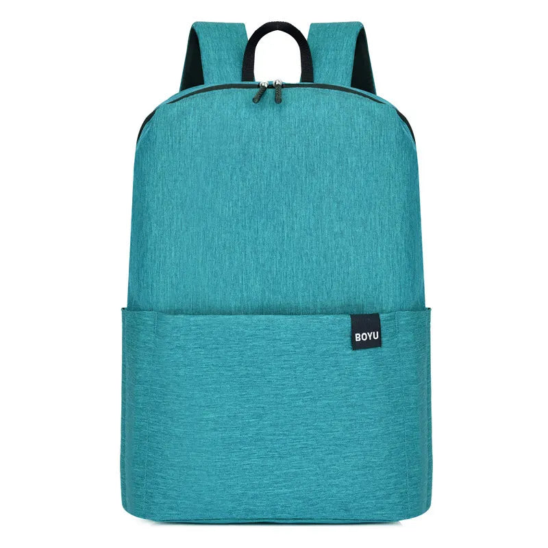 Textured aqua school backpack with minimalist design and front pocket.