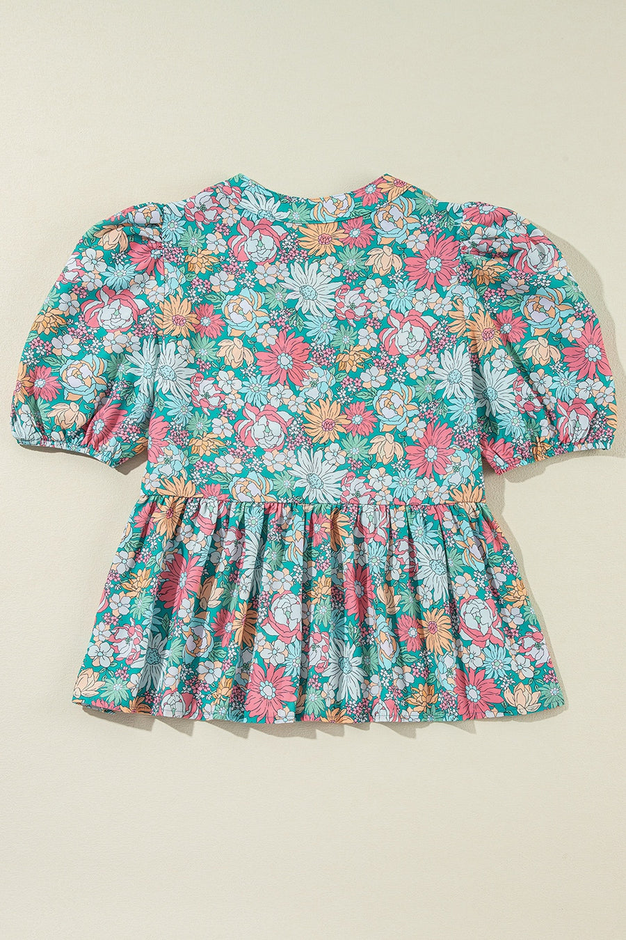 Floral peplum blouse with puff sleeves and scallop trim
