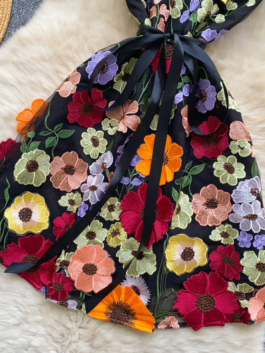 Black embroidered floral mini dress with bow detail