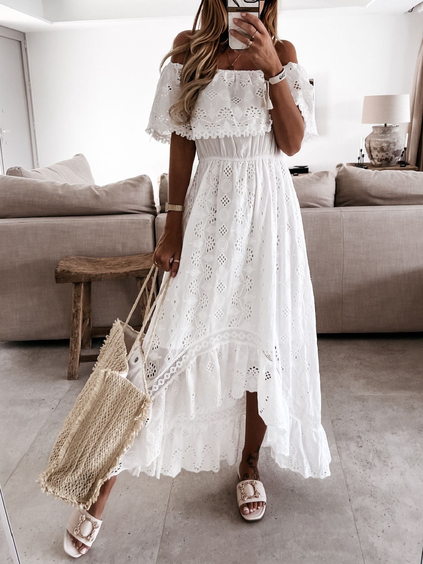 White eyelet lace off-shoulder maxi dress with ruffled trim and tiered skirt