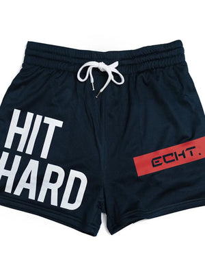 Navy mesh training shorts with white "HIT HARD" graphic and red "ECHT." logo detail.