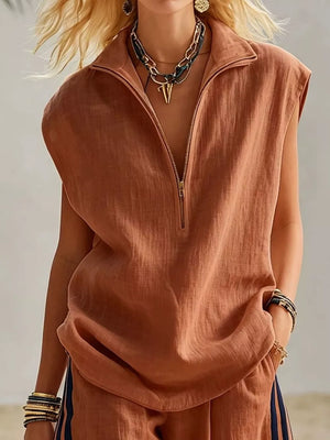 Sleeveless collared zip-front top in rust linen-blend with a relaxed fit.