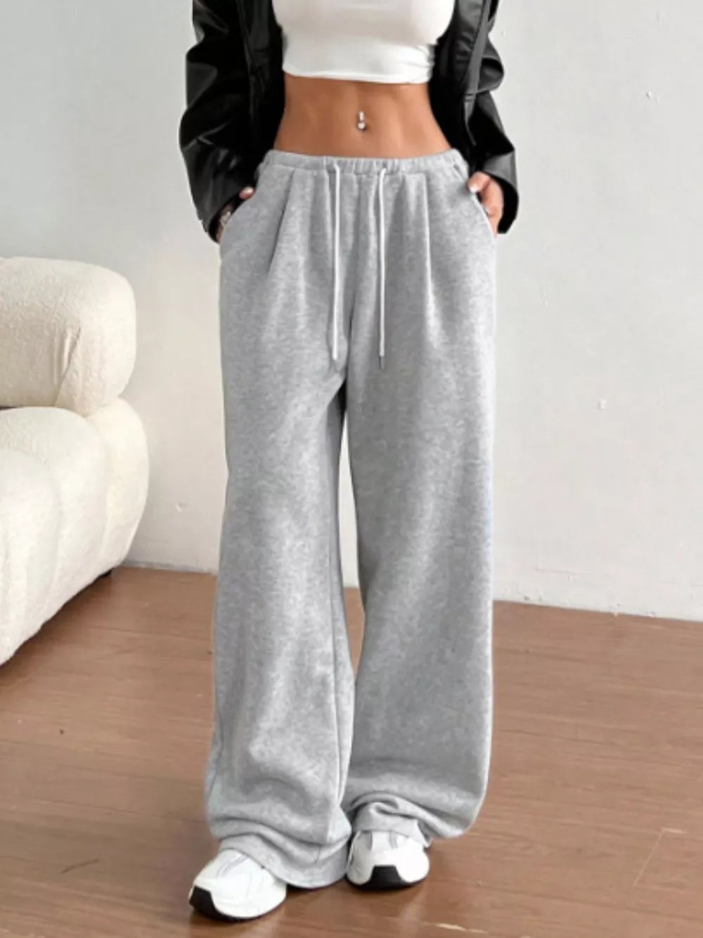 Gray wide-leg maternity joggers with drawstring waist and pockets.