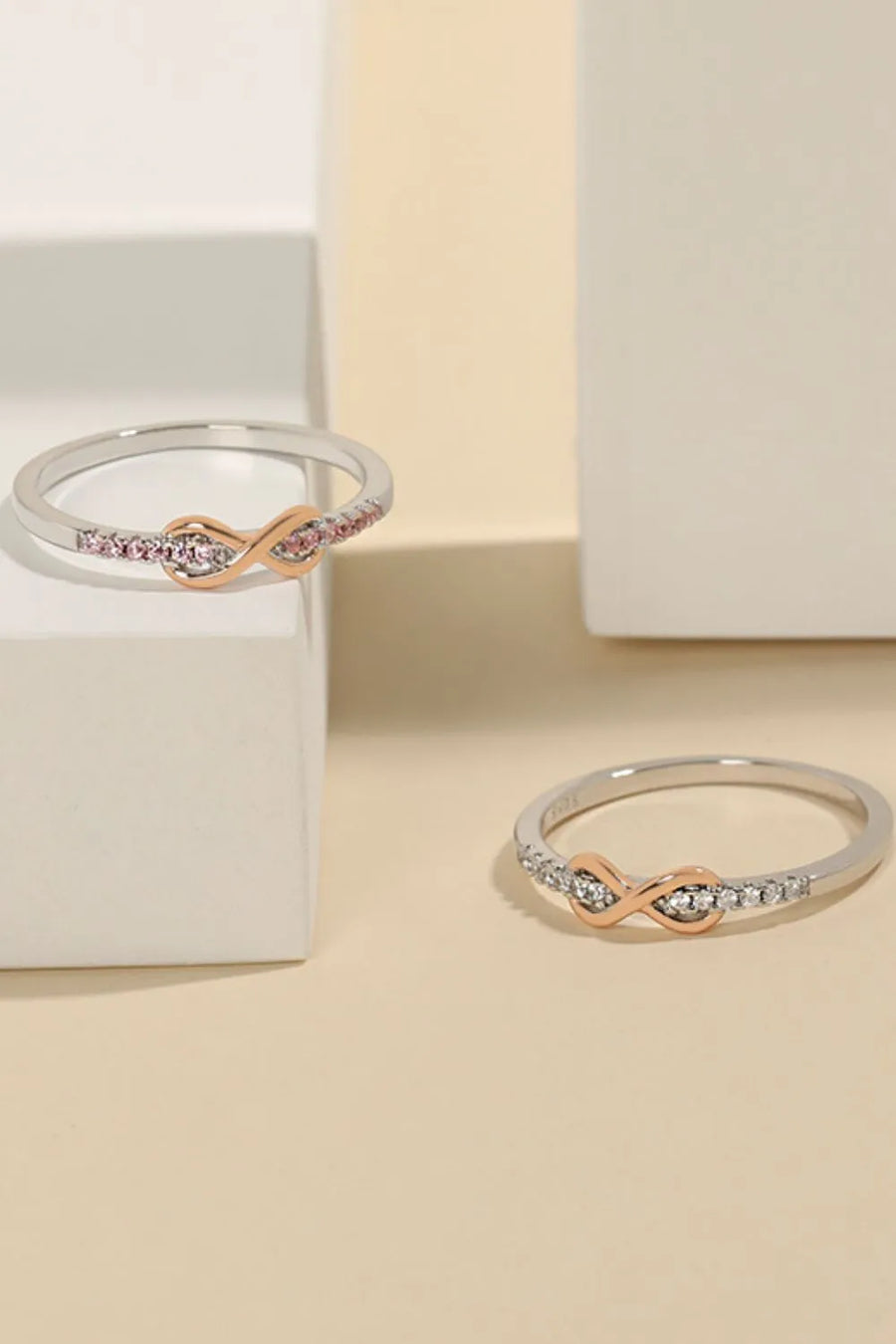 Eternity knot pavé ring in silver with rose gold accent and pink stones