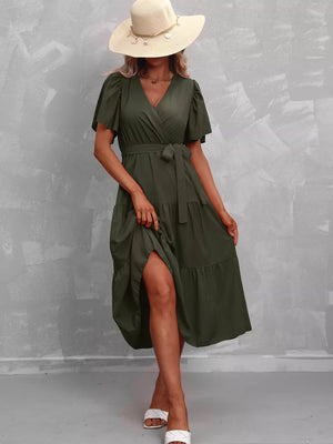Dark green belted midi dress with flutter sleeves and tiered skirt.