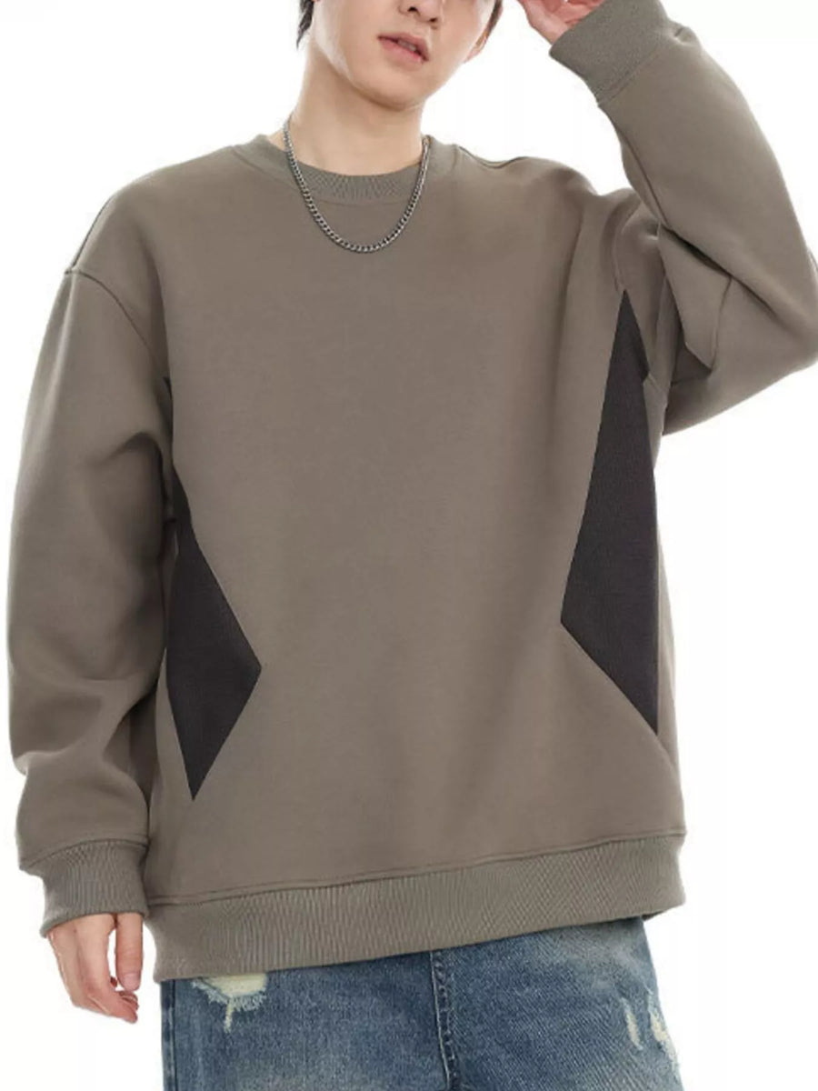 Oversized khaki cotton crew-neck sweatshirt with dark gray geometric panel details.