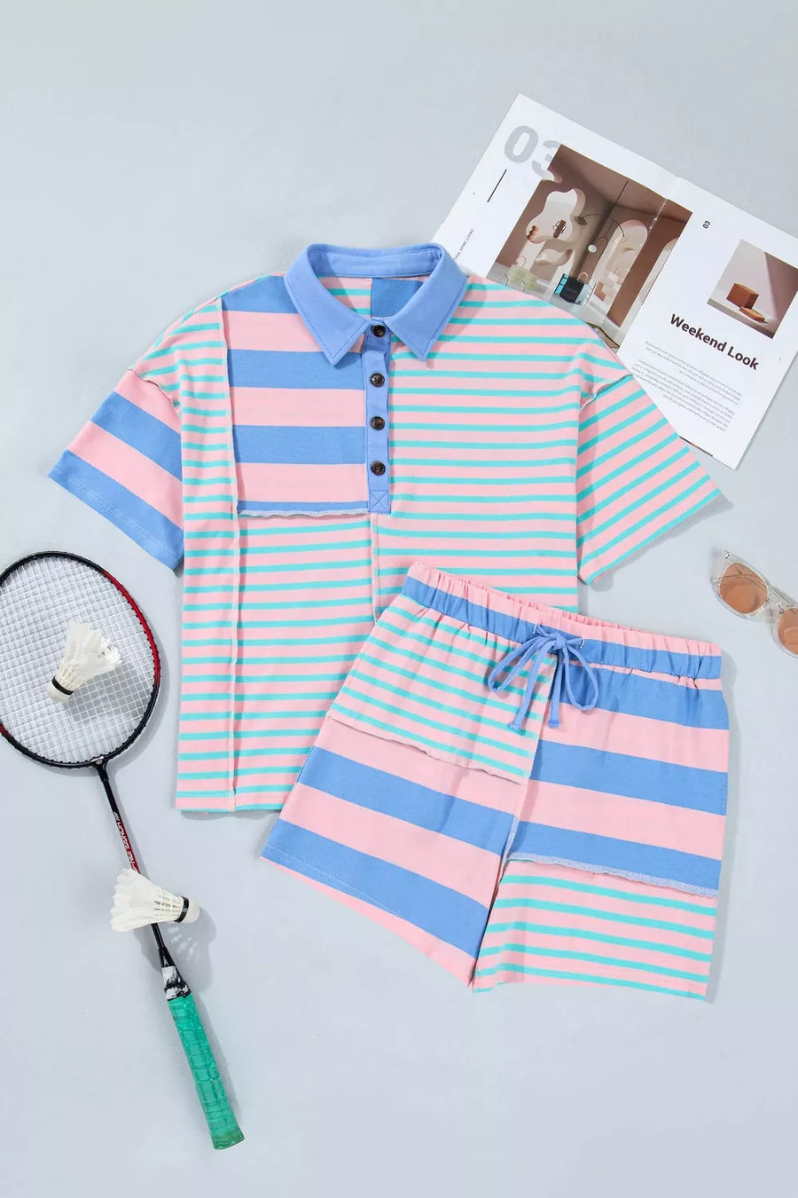 Pink, blue, and teal striped polo shirt and shorts set with a drawstring waist.