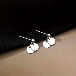 earrings in silver featuring round pieces and drop fit