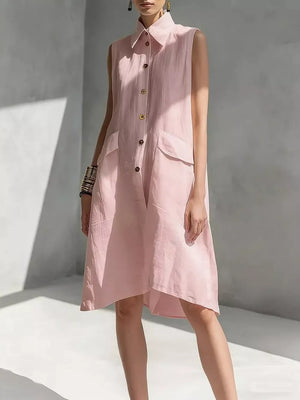 Sleeveless pink linen shirt dress with collar, button front, and flap pockets.