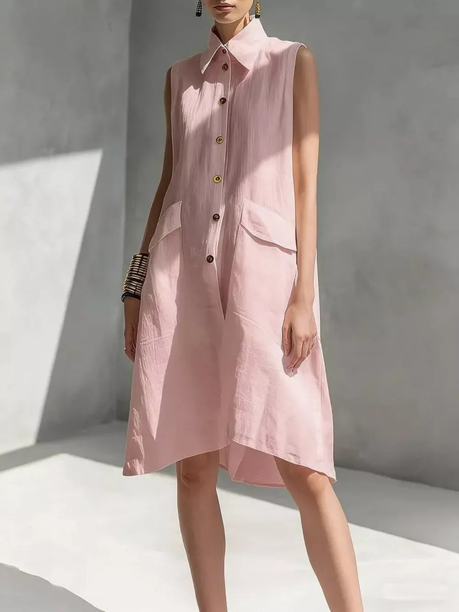Sleeveless pink linen shirt dress with collar, button front, and flap pockets.