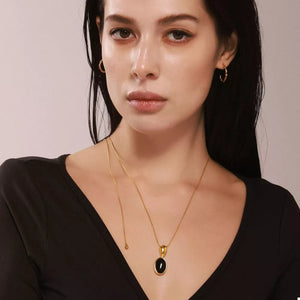 18K Gold-Plated, Stainless Steel, Black agate Care instructions: Avoid wearing d necklace in Gold with jewelry silhouette