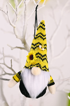 Yellow bee gnome ornament with sunflower and bee detail, hanging on a branch.