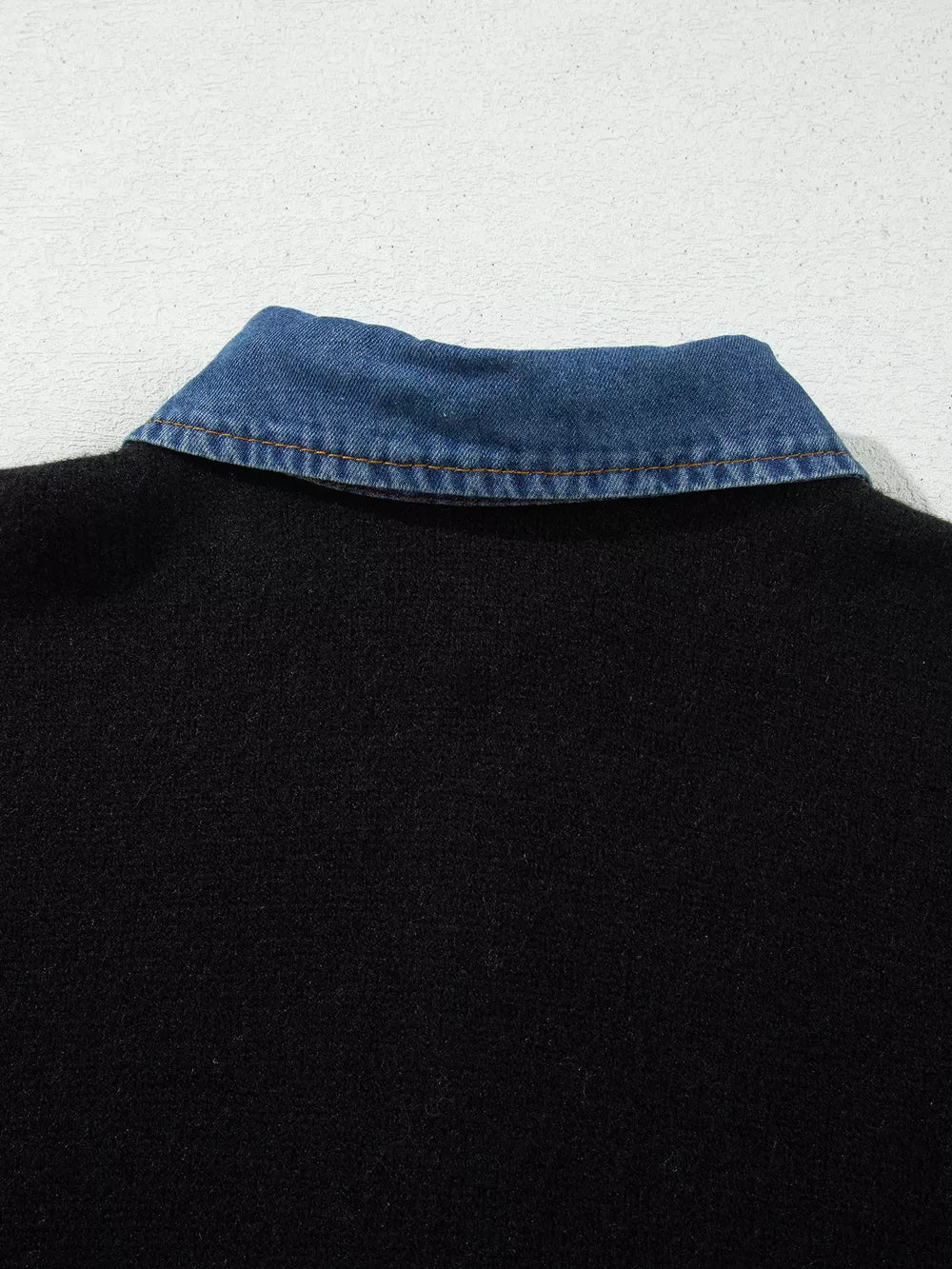 pullover sweater in black with buttoned and hip-length