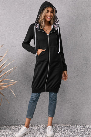 Black maxi hoodie dress with leopard print lining and white drawstrings.