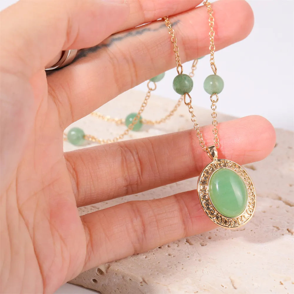 Gold chain necklace with oval neon green jade pendant and jade beads