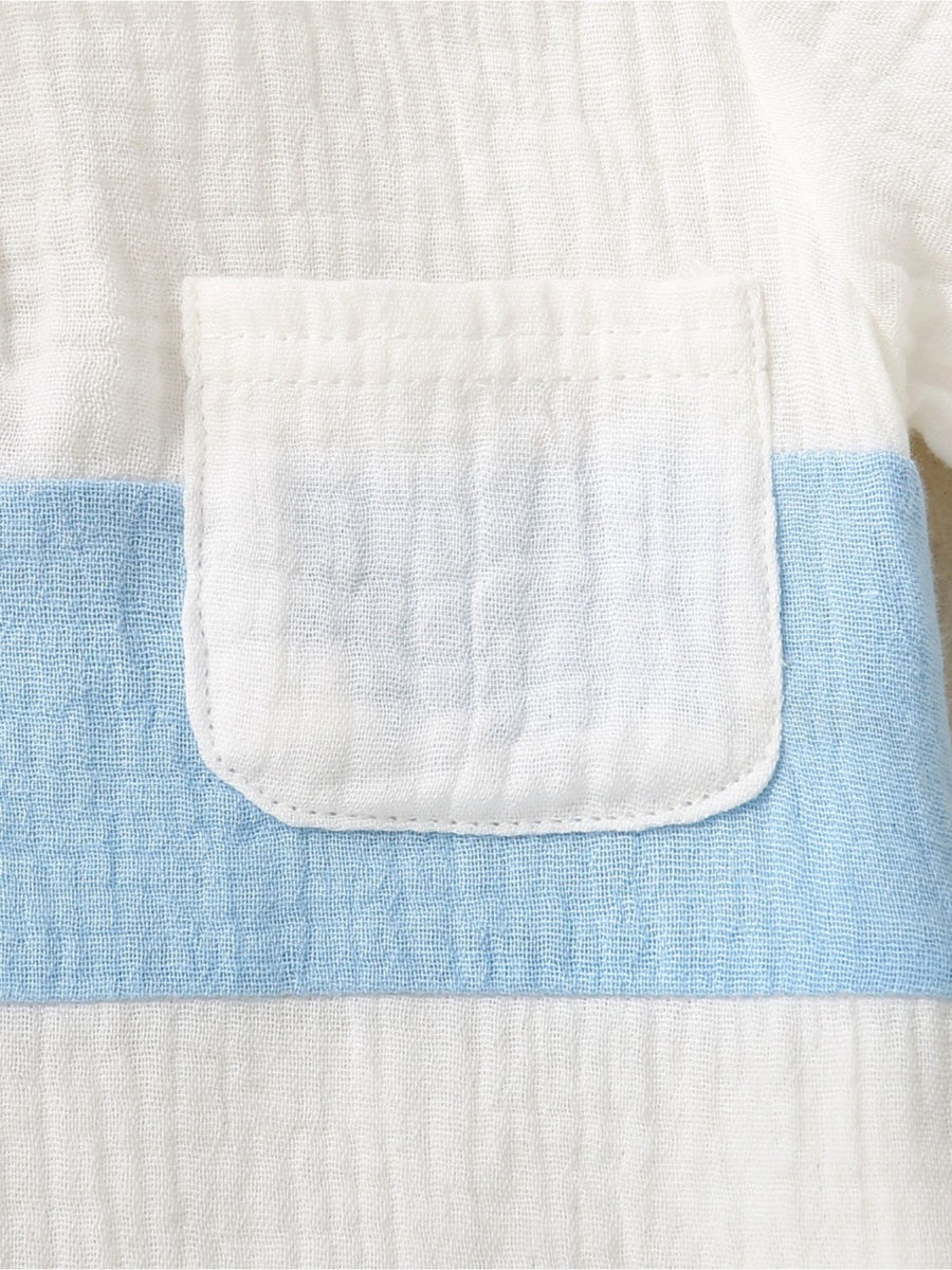 Children's cotton color-block top with a white pocket and blue stripe detail.