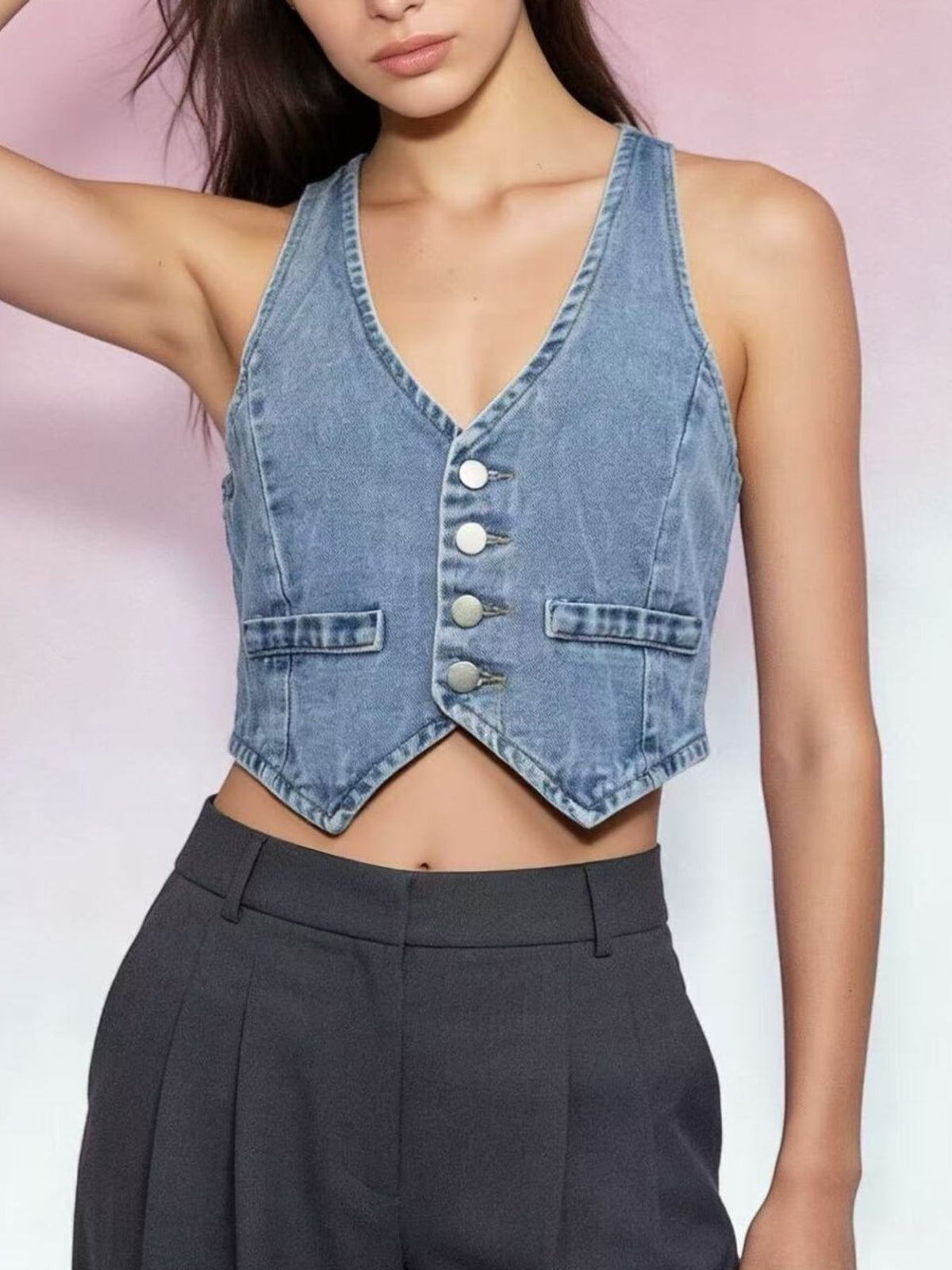 Light blue denim cropped vest with button-down front and pocket details