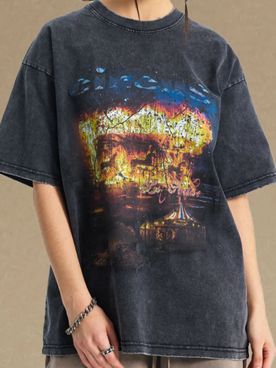Black oversized graphic tee with vintage circus print and distressed details.