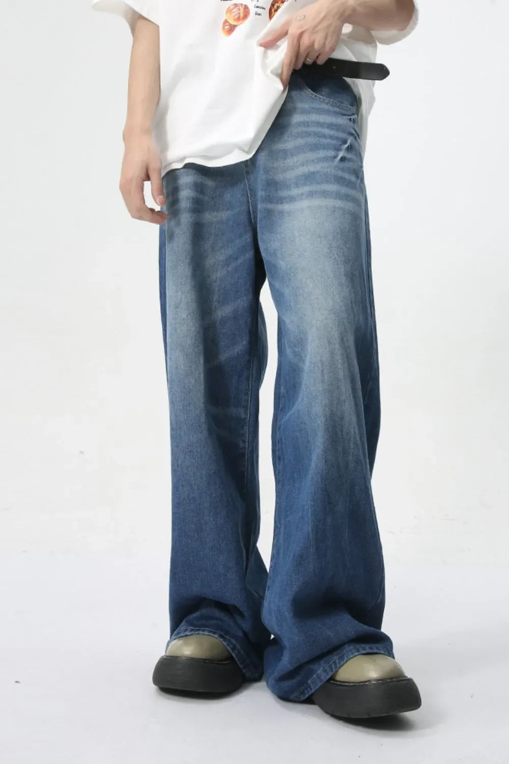 Oversized denim palazzo trousers in medium wash with a comfortable, wide leg and washed finish.