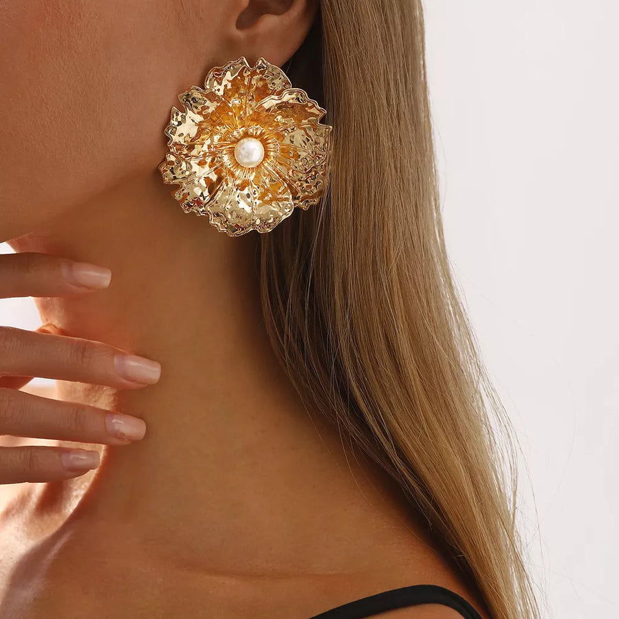 ivory earrings featuring textured and floral