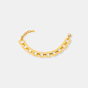 Gold geometric link bracelet with adjustable chain and clasp closure.