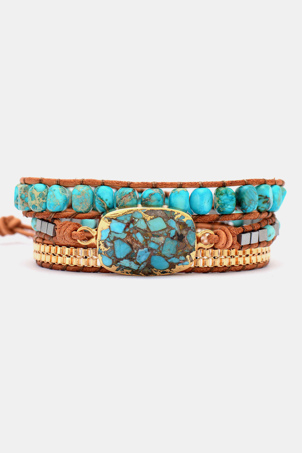 Turquoise and copper wrap bracelet set with natural stone and gold accents.